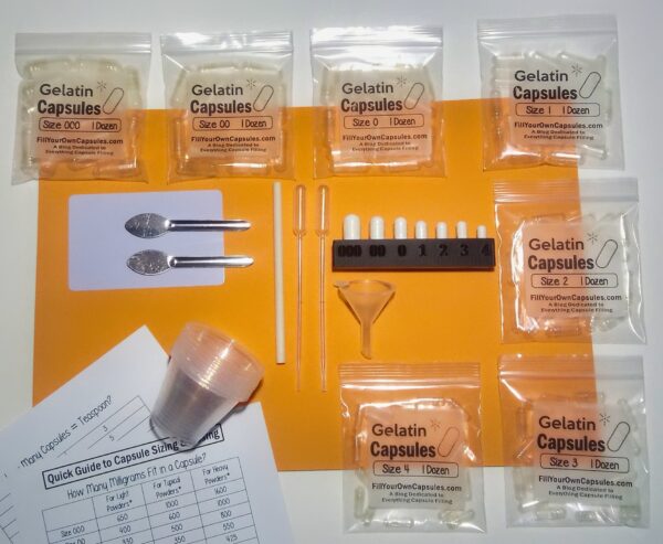 capsule holding tray with filling tool and capsules